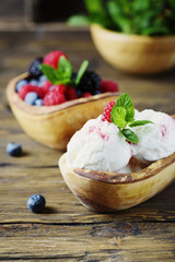 Fresh fruit ice cream with mint on the wooden background