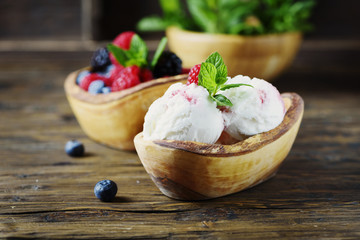 Fresh fruit ice cream with mint on the wooden background