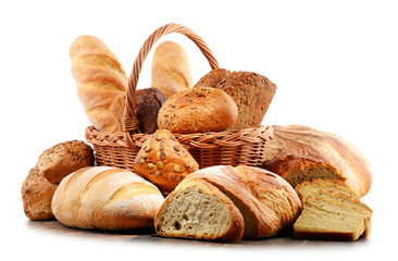 Wicker basket with assorted baking products isolated on white