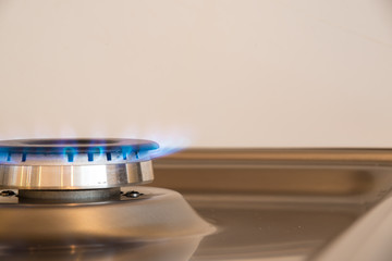 Gas flame coming from a gas cooker that provides the heating to the house