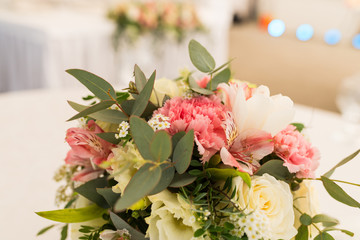 Pink carnation as a part of flower composition close up. Beautiful bouquet in pastel shape. Flower arrangement with carnation