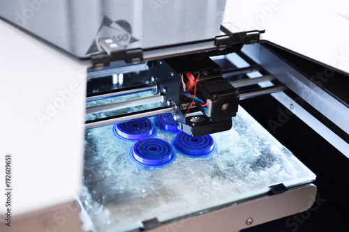 The 3D Printer Prints The Details Of The Blue Plastic 3D Printing Of ABS Or  PLA Plastic On A Transparent Glass Platform Poster-Sergey Privalov