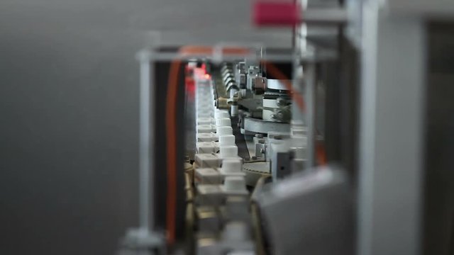 Dairy products in packagingaging are moving along the conveyor at a dairy factory.