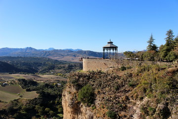 A beautiful view of the gorge, the valley, the observation deck and the rotunda/ Ronda, Andalucia,...