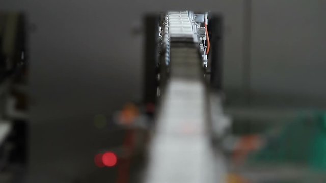 Milk package conveyor. Milk in cardboard packages on a conveyor belt.