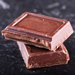 Chocolate in blocks over black background