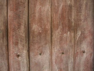 Background of old wooden boards with traces of paint. Toned.