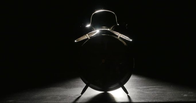 Twin Bell Alarm Clock Ringing Isolated on Black