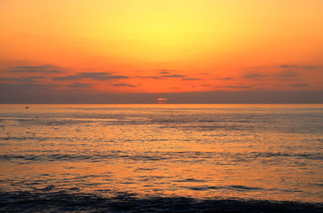 The Sunset over the Pacific Ocean from Ocean Beach near San Diego, California.
