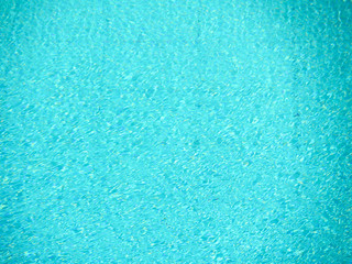 Fototapeta na wymiar swimming pool water surface has little wave by wind