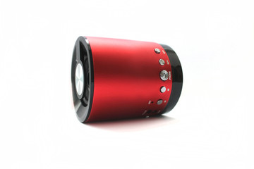 Portable speaker or wireless speaker or mini-column red color, isolated on white background.