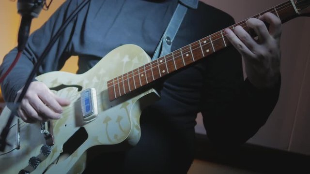 4k Musician playing jazz music by vintage electric guitar at recording studio