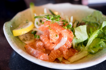 Japan salmon spicy salad with herbs