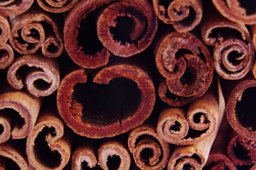 heap of cinnamon sticks as a background