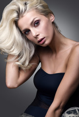 Fototapeta premium Portrait of beautiful woman with light, natural hair. Sensual look light makeup