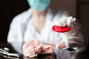 Whole meat sample in laboratory Petri dish.