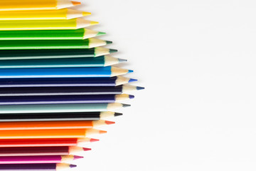 Several colored pencils on a white background with copy space