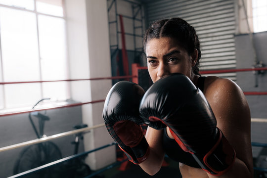 Female Boxer Training Inside A Boxing Ring