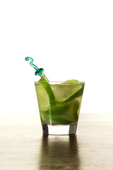 A glass of Caipirinha, is the most famous brazilian drink - lemon cachaca and ice - front foto