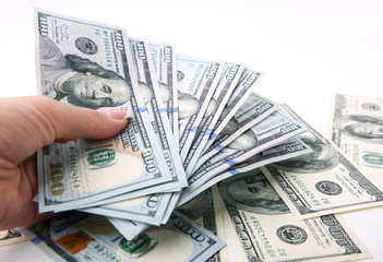 Money dollars in hand on white background.