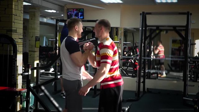 two athletes enjoy success in the gym