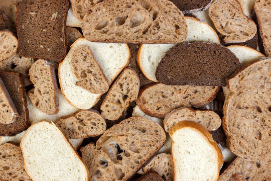 Many slices of bread as background. Top view