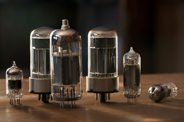 Various radio tubes on a wooden table
