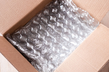 Plastic wrap with big bubbles in carton box