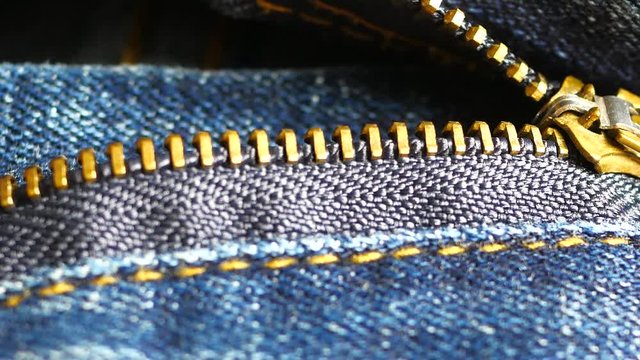 close up zipper of blue jeans.