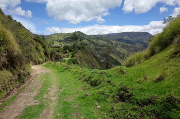 Fototapeta premium A mountain track winds through the Ecuadorian Andes on the Quilotoa Loop hike