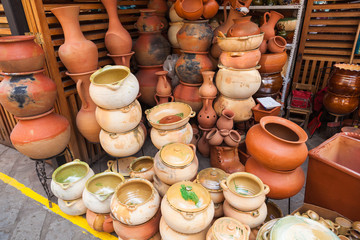 Pots, vases, bowls and rustic clay vases used in the kitchen for plants and decoration