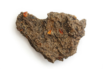 Rare rock sample of ground from the Taimyr Peninsula with pieces of amber on  white background. Taimyr amber in the ground. Extraction of rare samples of amber resins. Mineral. Natural stone. Sunstone