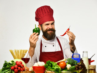 Chef prepares meal. Cooking process concept. Man with beard
