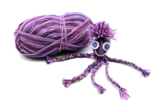 handmade octopus of wool on white isolated  background