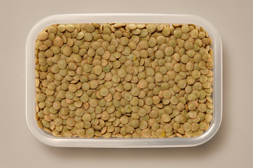 Whole Grains. Top View of Healthy grain foods in a White bowl on grey background with Real Shadow.