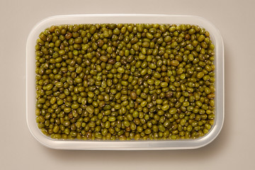 Whole Grains. Top View of Healthy grain foods in a White bowl on grey background with Real Shadow. Moyashi Beans.