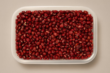 Whole Grains. Top View of Healthy grain foods in a White bowl on grey background with Real Shadow. Beans.