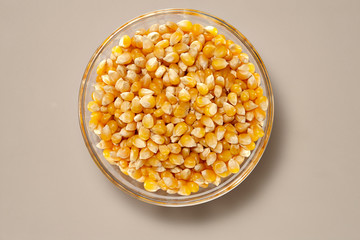 Whole Grains. Top View of Healthy grain foods in a Glass bowl on grey background with Real Shadow.