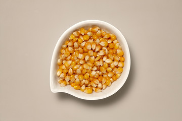 Whole Grains. Top View of Healthy grain foods in a White bowl on grey background with Real Shadow.