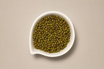 Whole Grains. Top View of Healthy grain foods in a White bowl on grey background with Real Shadow. Moyashi Beans..