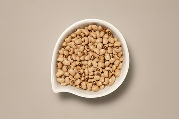 Whole Grains. Top View of Healthy grain foods in a White bowl on grey background with Real Shadow.