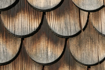 Wooden shingles on the facade of an old house in the Bregenzer Wald, traditionelle Bauweise im...