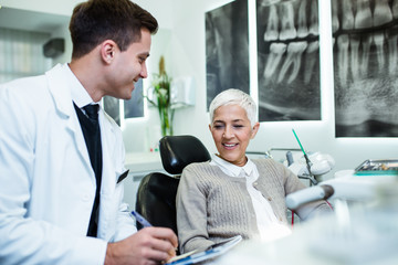 Fototapeta premium Beautiful senior woman receiving a dental treatment.