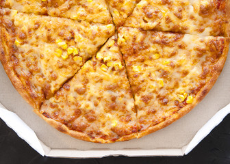 Pizza with ingredients on stone background 
