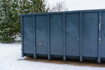 Trash bin at the side of street in winter