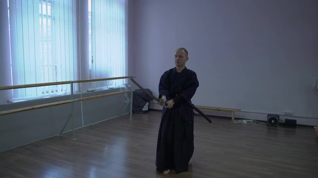 Master Kendo Performs Priyomyas with the Catana Sword, Trips Kata in the Sports Hall