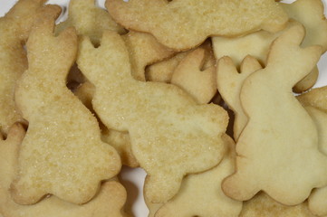Homemade butter cookies in shape of bunnies with spring decorations
