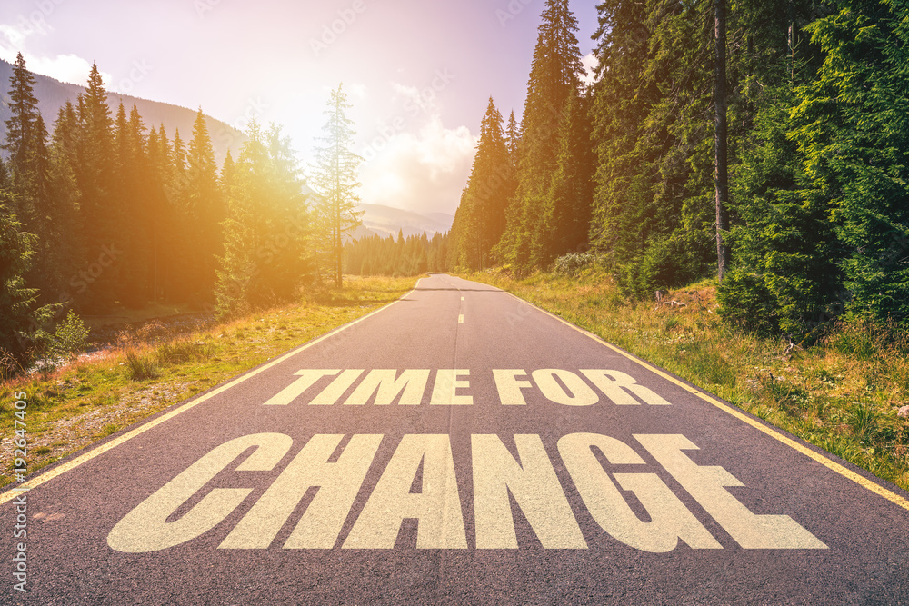 Wall mural Road concept - time for change, image of a road to the horizon with text time for change