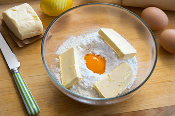 Ingredients for Christmas cookies in a glass bowl