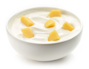 bowl of yogurt with mango pieces